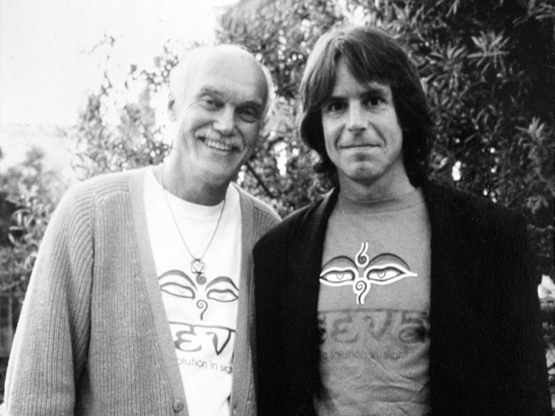 Ram Dass and Bob Weir wearing Seva shirts.